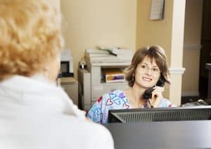 Receptionist Greeting Client